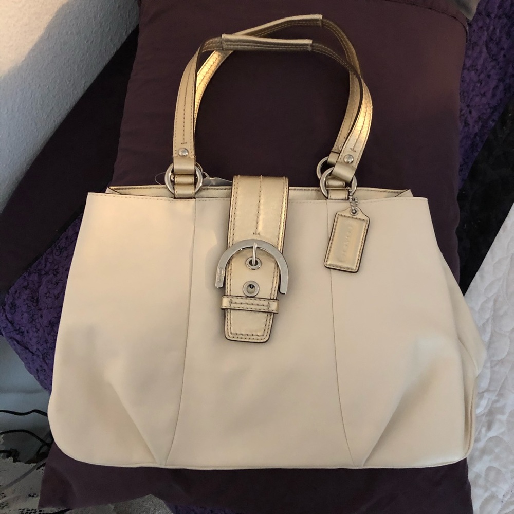 Coach bag - off white with gold trim/accents.